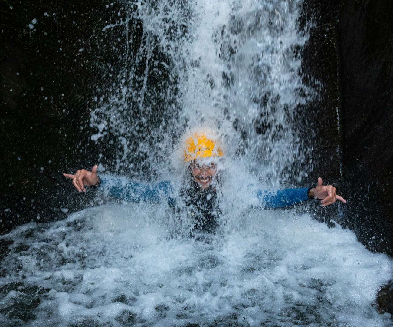 Abseil down waterfalls and slide along natural waterslides